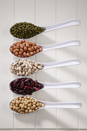 variety of beans group in five spoonsの写真素材