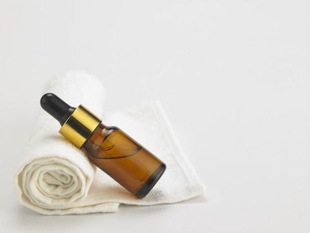 bottle of the massage oil on the face towelの写真素材