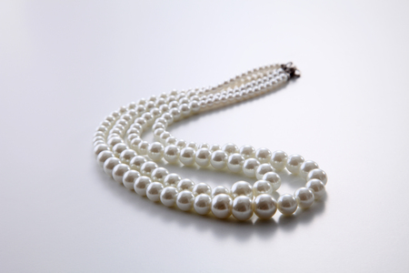 pearls necklace on the white backgroundの写真素材