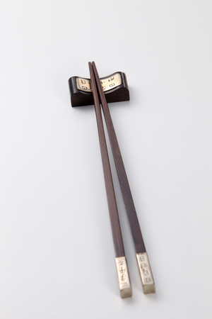 Pair of chopsticks on white backgroundの写真素材