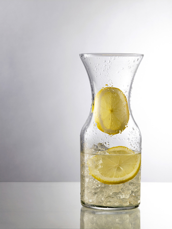 Refreshing Ice Cold Water with Lemon ready to drinkの写真素材