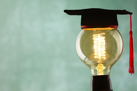 light bulb with mortar boardの写真素材