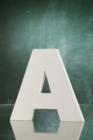 big alphabet in front of the chalk boardの写真素材