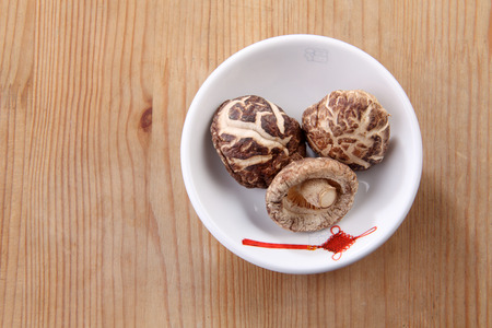 top view dry mushroom in the saucerの写真素材
