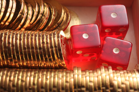 close up of the dices and the gold coinの写真素材