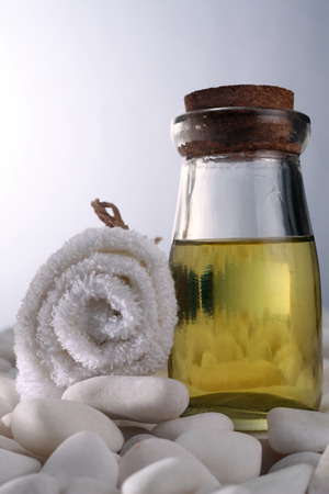 roll up of the towel and massage oilの写真素材