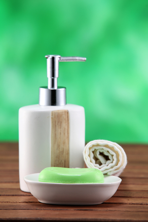 soap and dispenser  on the wooden table topの写真素材