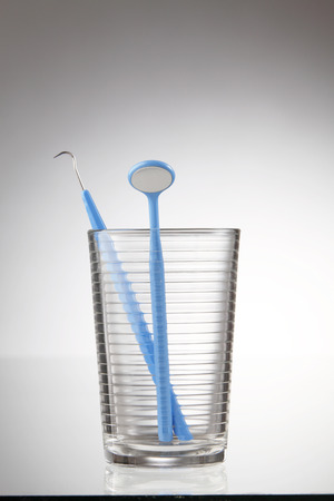 Dentist tools in glass table close upの写真素材