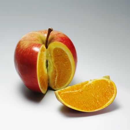 Photo manipulation: red apple with orange contentの写真素材