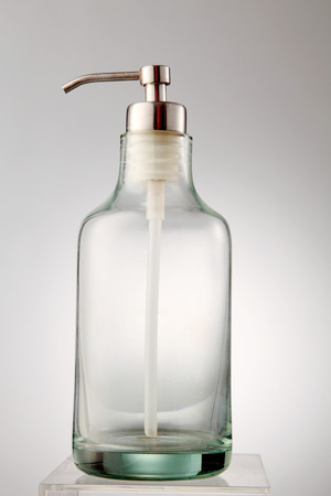 empty glass dispenser on the white backgroundの写真素材