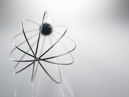 Metal whisk for whipping eggs isolated on whiteの写真素材