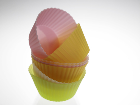 stack of the colorful cup cake wrapperの写真素材