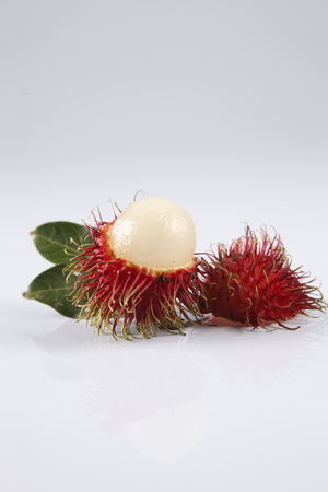 asian fruit rambutan on the plain backgroundの写真素材