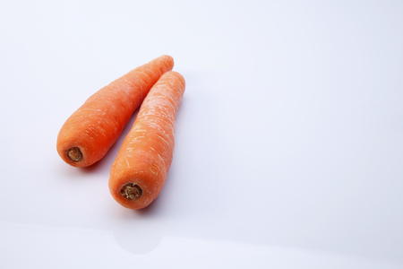 fresh carrot on the white backgroundの写真素材