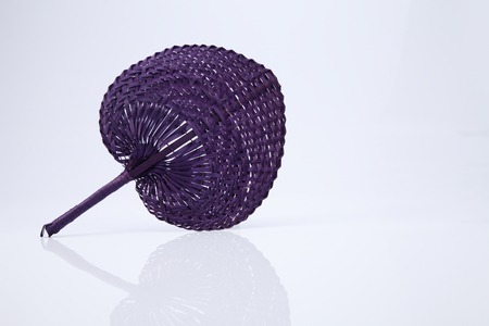 native fan made from palm leaves on white backgroundの写真素材