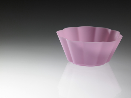 purple cupcake form isolated on whiteの写真素材