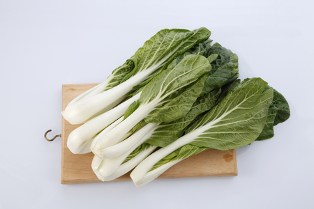 pak choy (chinese cabbage) isolated on whiteの写真素材