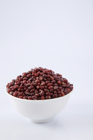 adzuki or red beans in a white bowlの写真素材