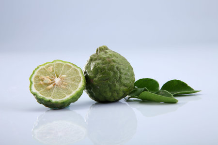 bergamot kaffir lime leaves and lime ingredient food asian thailand white background