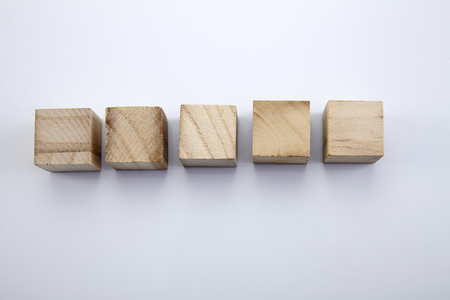 Five wood blocks in the white background.の写真素材