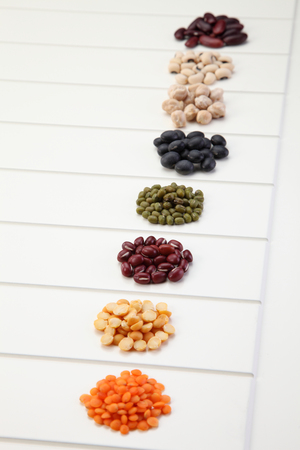 various type of beans on the white backgroundの写真素材