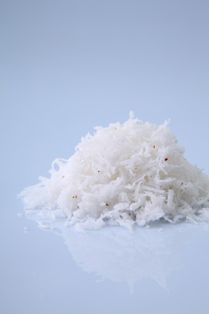 shredded coconut on the white backgroundの写真素材