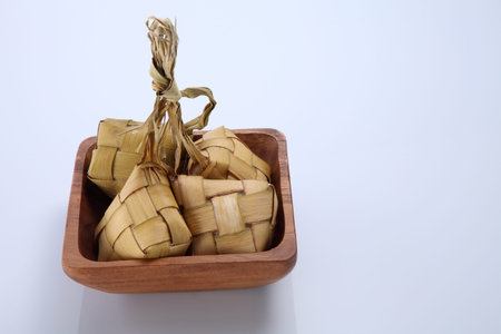 Ketupat (Rice Dumpling) On white Background. Ketupat is a natural rice casing made from young coconut leaves for cooking rice during eid Mubarakの写真素材