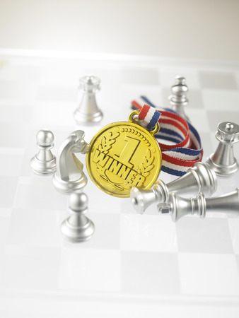 medal with chess pieces on the chess boardの写真素材