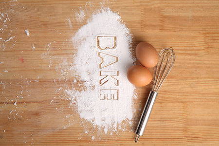 baking concept,hand whisk and eggs