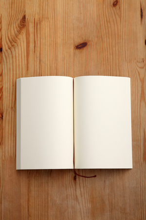open book on the brown tableの写真素材