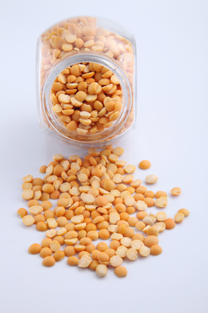 uncooked indian dhal lentil in a glass containerの写真素材