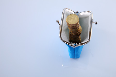 coins in the blue color purseの写真素材