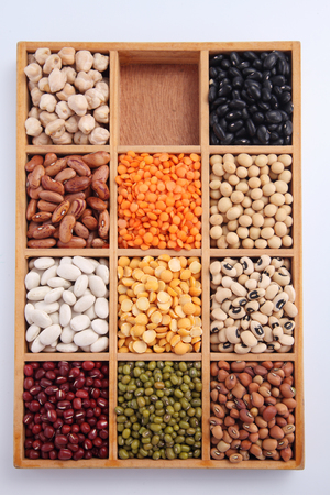 various beans contained in wood boxesの写真素材
