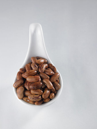 pinto bean in a white saucer