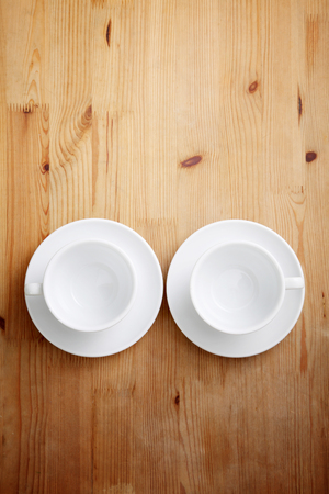 empty coffee cup or tea cup on the wooden tableの写真素材