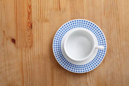 empty coffee cup or tea cup on the wooden tableの写真素材