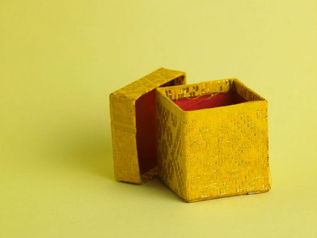 open yellow gift box on the yellow background