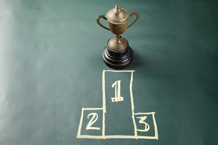 trophy on the blackboard with drawing podium1,2,3の写真素材