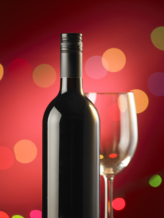bottle of red wine and wine with shallow depth of fieldの写真素材