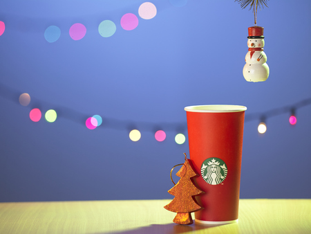 Kuala Lumpur -Malaysia,November 14, 2015: The new paper cup of Starbucks stores in the country for the Christmas on a red background cup. Starbucks brand is one of the world famous from USのeditorial素材