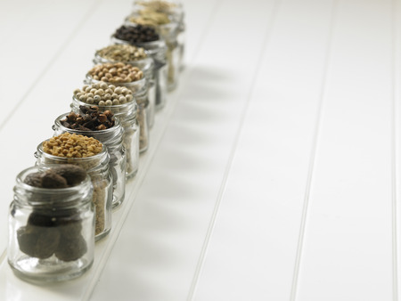 assorted spices in glass containerの写真素材