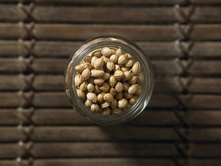 top view of coriander seeds in a containerの写真素材