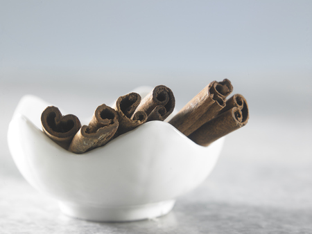 cinnamon sticks on marble topの写真素材