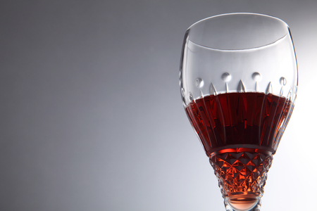 glass of red wine on the gray backgroundの写真素材