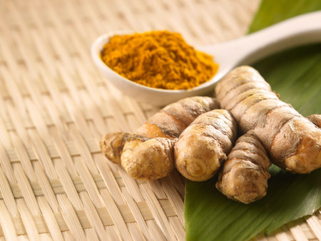turmeric, powder and leaf on the mamboo tray