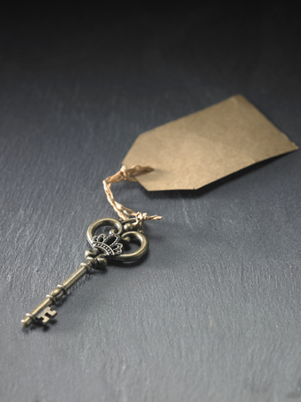 antique key with the label or tagの写真素材