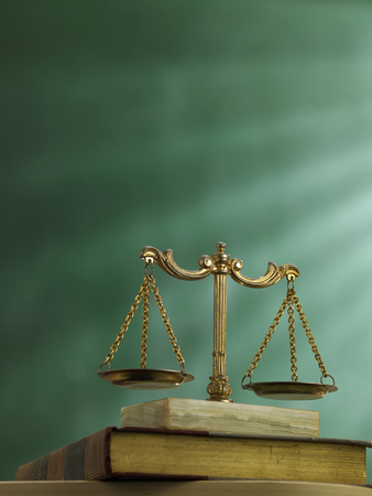 law scale on top of the law bookの写真素材