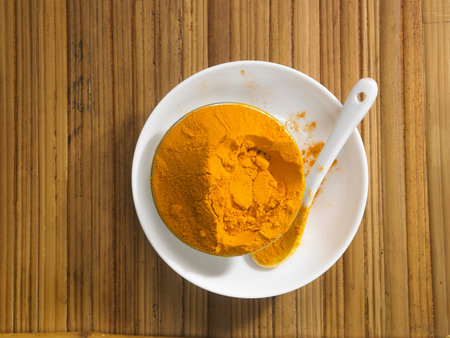 turmeric powder on the bamboo background