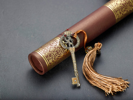 antique key with tassel lean on certificate holder