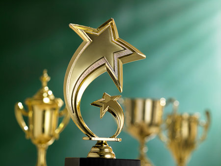 group trophies in front of blackboard with light ray effect